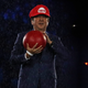 Shinzo Abe wears a red hat like the kind worn by Super Mario